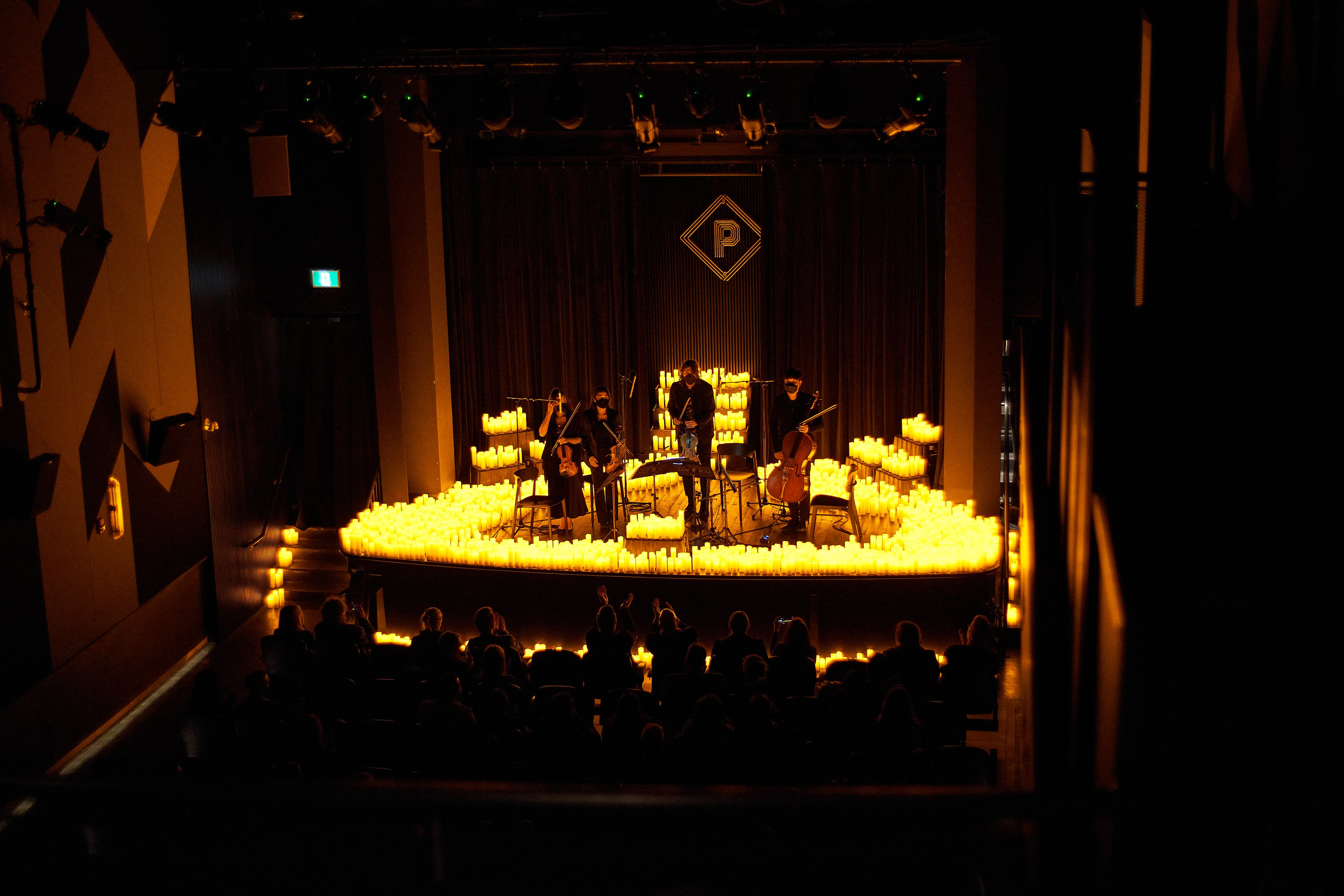 Musicians performing by candlelight 