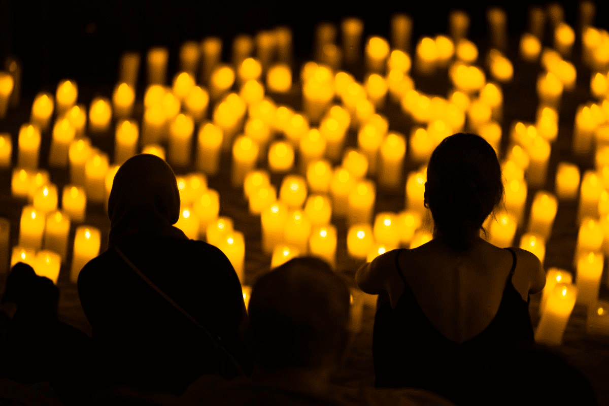 Audience watching a candlelit concert